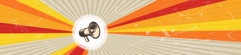 A megaphone is inside of a white circle with red, orange and yellow rays expanding outward.